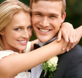 bigstock-Newlyweds-embrace-each-other-l-39922936